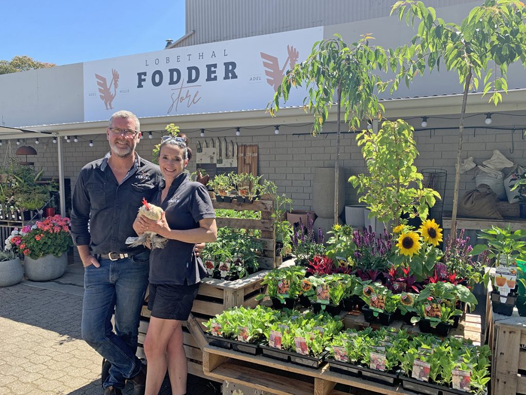Natalie and Matt Egan with Glen the rooster at the Lobethal Fodder Store.
